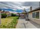 Home's backyard with covered patio, basketball hoop, and low maintenance landscape, perfect for outdoor living at 872 Linn Ln, Las Vegas, NV 89110