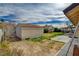 Backyard showcasing a storage shed, green grass, and a covered patio area with potential for outdoor enjoyment at 872 Linn Ln, Las Vegas, NV 89110