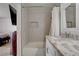 Bathroom featuring a tub, shower with white tile surround, and a vanity with a marble countertop at 872 Linn Ln, Las Vegas, NV 89110