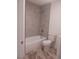 Modern bathroom featuring a bathtub, tiled shower, and neutral-tone flooring at 872 Linn Ln, Las Vegas, NV 89110