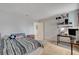 Bright bedroom with a cozy bed, desk, and easy access to door at 872 Linn Ln, Las Vegas, NV 89110