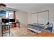 Bedroom with a spacious closet, desk, and a comfortable bed at 872 Linn Ln, Las Vegas, NV 89110