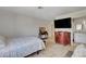 Well-lit bedroom featuring a media center and an en-suite bathroom at 872 Linn Ln, Las Vegas, NV 89110