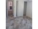 Neutral bedroom features white walls, large closet, and tile floors at 872 Linn Ln, Las Vegas, NV 89110