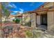Home featuring brick accents, mature trees, and outdoor seating at 872 Linn Ln, Las Vegas, NV 89110