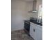 Cozy kitchen with stainless steel appliances, range hood, and modern cabinets at 872 Linn Ln, Las Vegas, NV 89110