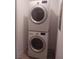 Modern laundry area with stacked washer and dryer at 872 Linn Ln, Las Vegas, NV 89110
