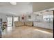 Bright living room featuring tile floors and access to the backyard patio at 872 Linn Ln, Las Vegas, NV 89110