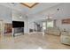 Spacious living room with tile flooring, fireplace, and backyard access at 872 Linn Ln, Las Vegas, NV 89110