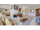 Bright living room features a white brick fireplace and beige tile flooring at 872 Linn Ln, Las Vegas, NV 89110