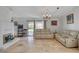 Open-concept living room with fireplace and sliding door to backyard at 872 Linn Ln, Las Vegas, NV 89110