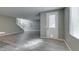 Bright entryway with a decorative glass door, tile flooring, and stairs leading to the upper level at 9239 Albus Hills Ave, Las Vegas, NV 89143