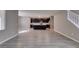 Expansive living space with modern tile flooring and an open-concept layout at 9239 Albus Hills Ave, Las Vegas, NV 89143