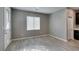 Living area featuring tile floors and a front door with decorative glass at 9239 Albus Hills Ave, Las Vegas, NV 89143