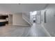 Open-concept layout with tile flooring and staircase leading to upper level at 9239 Albus Hills Ave, Las Vegas, NV 89143