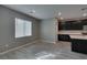 Bright living area with modern tile flooring adjacent to the stylish kitchen at 9239 Albus Hills Ave, Las Vegas, NV 89143