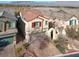 Stunning aerial view of a two-story home with a red tile roof in a well-kept neighborhood at 10556 Nantucket Ridge Ave, Las Vegas, NV 89166
