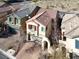 Aerial view of a charming two-story home with a red tile roof and a brick driveway at 10556 Nantucket Ridge Ave, Las Vegas, NV 89166