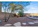 Spacious backyard featuring desert landscaping, decorative rock, and a stone patio at 10556 Nantucket Ridge Ave, Las Vegas, NV 89166