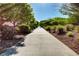 A wide community sidewalk offers residents a place to walk and enjoy the outdoors at 10556 Nantucket Ridge Ave, Las Vegas, NV 89166