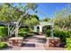 A beautiful stone path leads through a lush community garden with an arbor at 10556 Nantucket Ridge Ave, Las Vegas, NV 89166