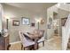The dining room features tile flooring, wood furnishings, and natural lighting at 10556 Nantucket Ridge Ave, Las Vegas, NV 89166