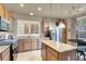 Modern kitchen with a large island, granite countertops, and stainless steel appliances at 10556 Nantucket Ridge Ave, Las Vegas, NV 89166