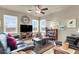 Cozy living room featuring comfortable seating, large windows, and neutral tones at 10556 Nantucket Ridge Ave, Las Vegas, NV 89166
