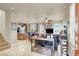 Spacious open-concept living room area with tile flooring and staircase view at 10556 Nantucket Ridge Ave, Las Vegas, NV 89166