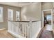 Bright upstairs hallway featuring wood floors, natural light, and an inviting ambiance at 10556 Nantucket Ridge Ave, Las Vegas, NV 89166