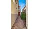 Paver pathway leading to the front door with desert landscaping at 10556 Nantucket Ridge Ave, Las Vegas, NV 89166