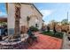 Outdoor space featuring a red brick patio and artificial grass, perfect for exercising and enjoying time outside at 1071 Nordyke Ave, Henderson, NV 89015