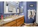 Bathroom featuring granite counters and a double sink at 1071 Nordyke Ave, Henderson, NV 89015