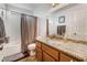 This bathroom features a granite vanity top, a shower with a bathtub, and neutral colors at 1071 Nordyke Ave, Henderson, NV 89015