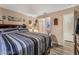 Bedroom featuring a wooden bed and ensuite bathroom access at 1071 Nordyke Ave, Henderson, NV 89015