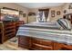 Bedroom with a TV on dresser and striped bedding at 1071 Nordyke Ave, Henderson, NV 89015