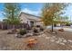 View of the desert landscaped front yard with decorative rocks and desert shrubs at 1071 Nordyke Ave, Henderson, NV 89015