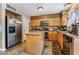 Well-equipped kitchen with granite countertops, an island, and stainless steel appliances at 1071 Nordyke Ave, Henderson, NV 89015