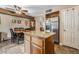Spacious kitchen with granite countertops, an island, and adjacent dining area at 1071 Nordyke Ave, Henderson, NV 89015