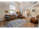 Living room with vaulted ceiling, a large window, and hardwood floors at 1071 Nordyke Ave, Henderson, NV 89015