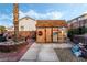 Backyard featuring a storage shed with unique decorative signage at 1071 Nordyke Ave, Henderson, NV 89015