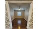 A bedroom featuring hardwood floors, neutral walls, and windows with plantation shutters at 10732 Irving Park Ave, Las Vegas, NV 89166