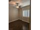 Bedroom with a ceiling fan, hardwood floors and plantation shutters at 10732 Irving Park Ave, Las Vegas, NV 89166