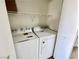 The laundry room features a new washer and dryer, as well as added storage at 1150 N Buffalo Dr # 1005, Las Vegas, NV 89128