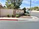 Inviting community entrance with a decorative sign, showcasing manicured landscaping, creating a welcoming atmosphere at 1150 N Buffalo Dr # 1005, Las Vegas, NV 89128