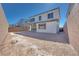 An empty backyard with exterior home view and privacy fence, ready for customization at 1320 Crimson Sunbird Ave, North Las Vegas, NV 89084