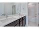 Bathroom features double sinks with white countertops and a tub at 1320 Crimson Sunbird Ave, North Las Vegas, NV 89084
