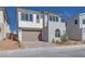 Charming two-story home featuring a two car garage, neutral stucco, and mature landscaping at 1320 Crimson Sunbird Ave, North Las Vegas, NV 89084