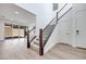 Bright foyer featuring an open staircase and wood look floors at 1320 Crimson Sunbird Ave, North Las Vegas, NV 89084