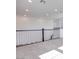 Carpeted hallway with modern railing and white walls at 1320 Crimson Sunbird Ave, North Las Vegas, NV 89084